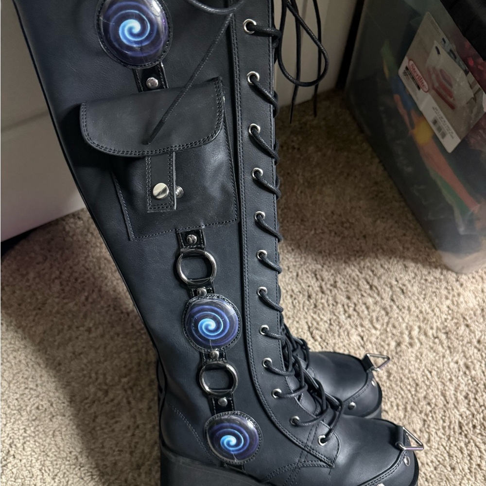 Demonia  Black Lace-Up Platform Knee-High Boots with Swirl Accents
